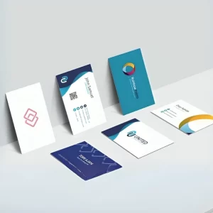 Modern business cards with blue, teal, and orange designs arranged on light surface – Business Card Printing London showcase.